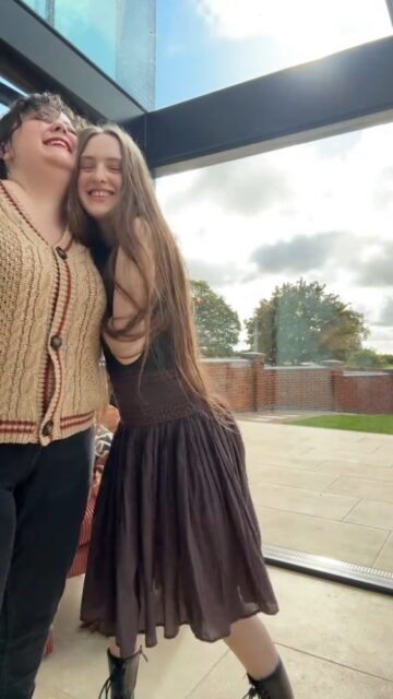 Throwback to meeting up with the one and only @sakaradee 🌻 We always have the best giggle.VD: A white woman with brown hair, sitting on a train, working on a laptop. The video then cuts to two white girls, standing giving each other a hug and dancing to Fearless by Taylor Swift.