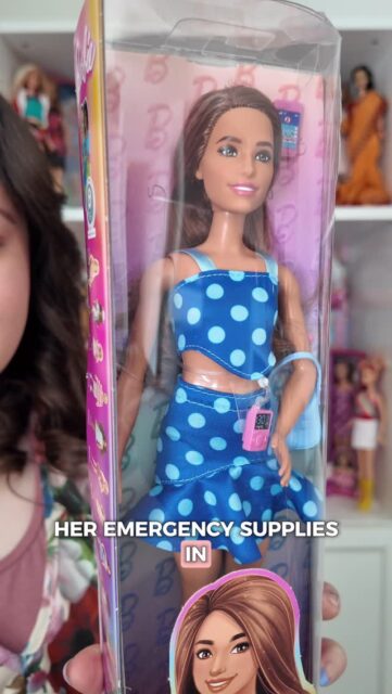 Have you seen T1 diabetic @barbie ?
She has a continuous glucose monitor along with an insulin pump, as well as a cute bag for her supplies!A new favourite from the inclusive range 🦽VD: A white woman, with brown shoulder length hair wearing a floral dress. She is stood in front of a wall of Barbie’s and holding a doll in its box.