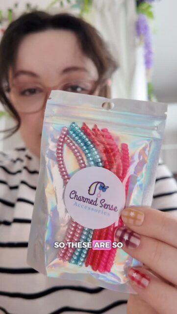 It’s time to unbox some happy mail from @charmed.sense.accessories - this one is dreamy 😍Decorate your own hearing aids, browse the Charmed Sense Accessories shop on Etsy.Ad -  Gifted items (but I genuinely do use them all the time!)VD: A white woman with brown curled hair in an updo, wearing a stripey top. She is sitting in a bedroom space, where you can see various decorations, such as hanging wisteria and ivy.(Hashtags)
#HearingAidAccessories #DisabledFashion #HearingAccessories