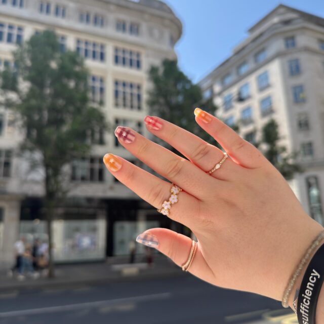 I’ve become a press-on nail girlie somehow ✨ Turns out, with the right glue and preparation they can actually last 2+ weeks and take less time to apply than finding and getting to a wheelchair accessible nail salon near me 👀VD: A white womans right hand up against the light with various rings. The background is a building in London. The nails have a checkered print and stars in pastel colours.(Hashtags)
#DisabilityHack #PressOns #AccessibleBeauty