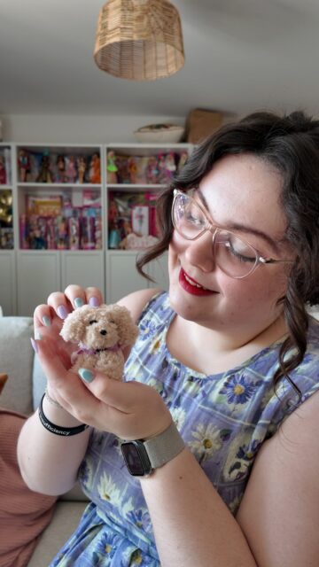 If anyone wonders what I’ve spent the last 10 days doing, then here we are… 🐾If you’d like to get your hands on a doggy of your own, please let me know. If you’d like to make a donation for our fundraising please tap the link in my stories or bio!VD: A white woman with brown hair, wearing a vintage lilac dress. She is holding up various brown, beige and grey tone fluffy hand sized dogs, which she has made for charity.