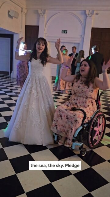 Long live all the magic we made. 🤍 More photos from this beautiful wedding to come, but for now I was desperate to share this moment Beth and I had on the dance floor... So honoured to have been a part of Beth and Dans special day in August ✨VD: Two white women, one wearing a white sparkly wedding dress and one wearing a pink dress in a wheelchair. They are both dancing in sync to Taylor Swifts 'The Fate Of Ophelia' and smiling.