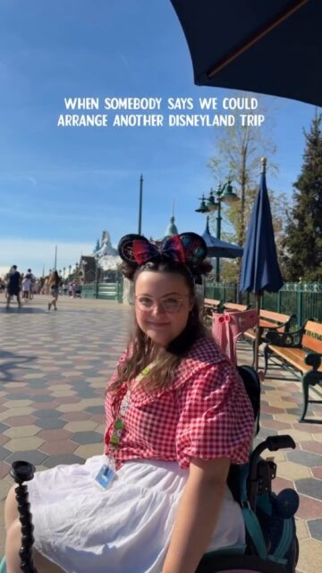 @disneyparksuk ready for your call anyday now... ✨VD: Imali, a white woman with brown hair, wearing PJ's. She turns to the camera, and her outfit changes. She is then at Disneyland, wearing a Minnie Mouse inspired outfit and metallic ears. She turns her wheelchair and puts her arms in the air.
