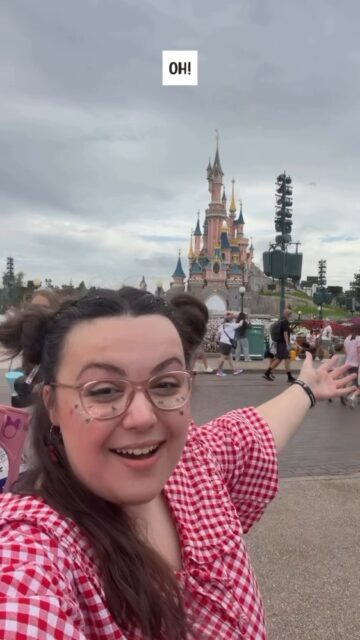 Taylor said Paris, I heard Disneyland. Close enough, right?VD: A white woman, with brown hair which is half up and half town in a sort of Mickey Mouse style, wearing a red gingham top. She is covered in glitter, and filming in selfie mode whilst sitting in her wheelchair. She pans around half way through the video, to show the legendary pink castle at Disneyland Paris. She's lip syncing to a Taylor Swift song.