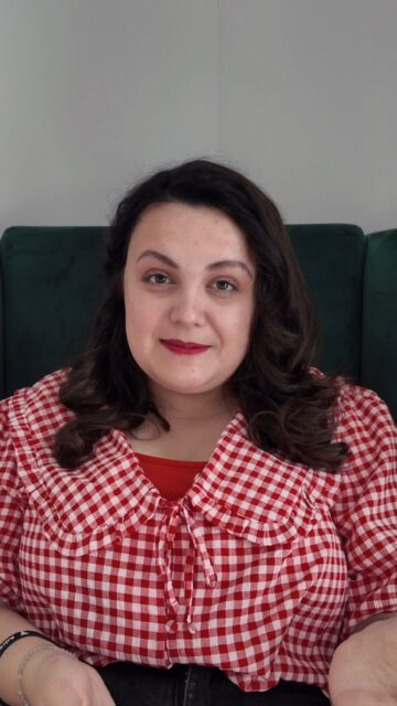 This World Arthritis Day let's spread some awareness about how the condition can affect young people.VD: A white woman, with brown curled hair, wearing red lipstick. Her outfit consists of a red gingham top with a peter pan collar and a red vest top underneath. She is sitting directly in front of the camera, talking.