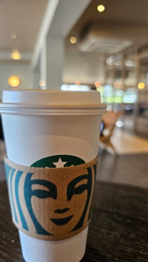 Starbucks Coffee Cup on table at a coffee shop - what you can claim for as a disabled person