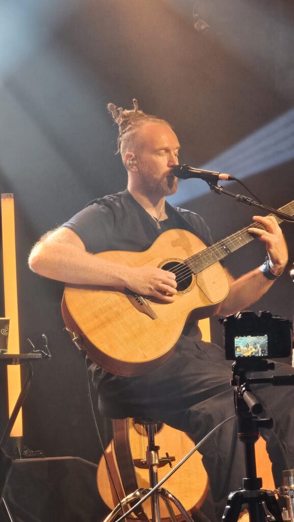 Newton Faulkner playing guitar